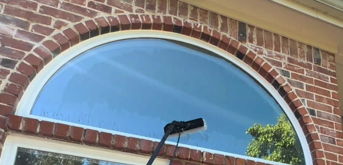 Hard water stain removal on arched windows in Naples FL